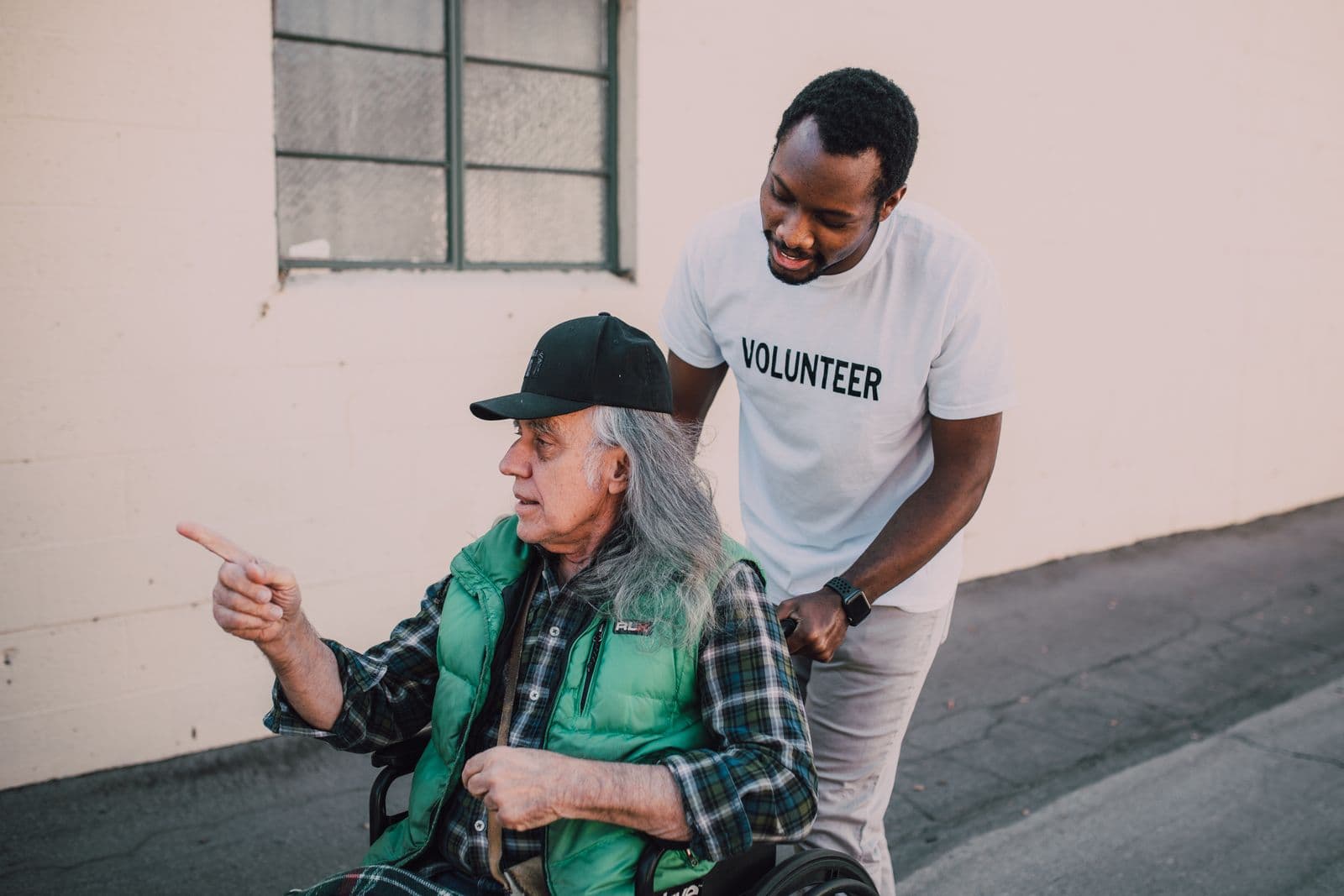 Hands offering support in a community giving moment